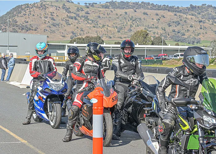 Motorcycle riders lined up in full gear on hire bikes at Murray Valley Training Centre